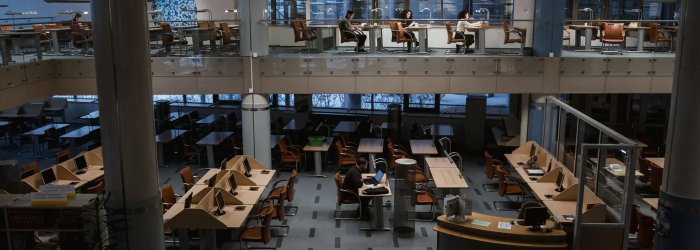 Students working in a library study space